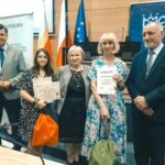 R. Kosowski, H. Cimer, prof. J.T. Duda i laureat konkursu wraz z opiekunem