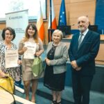 R. Kosowski, H. Cimer, prof. J.T. Duda i laureat konkursu wraz z opiekunem